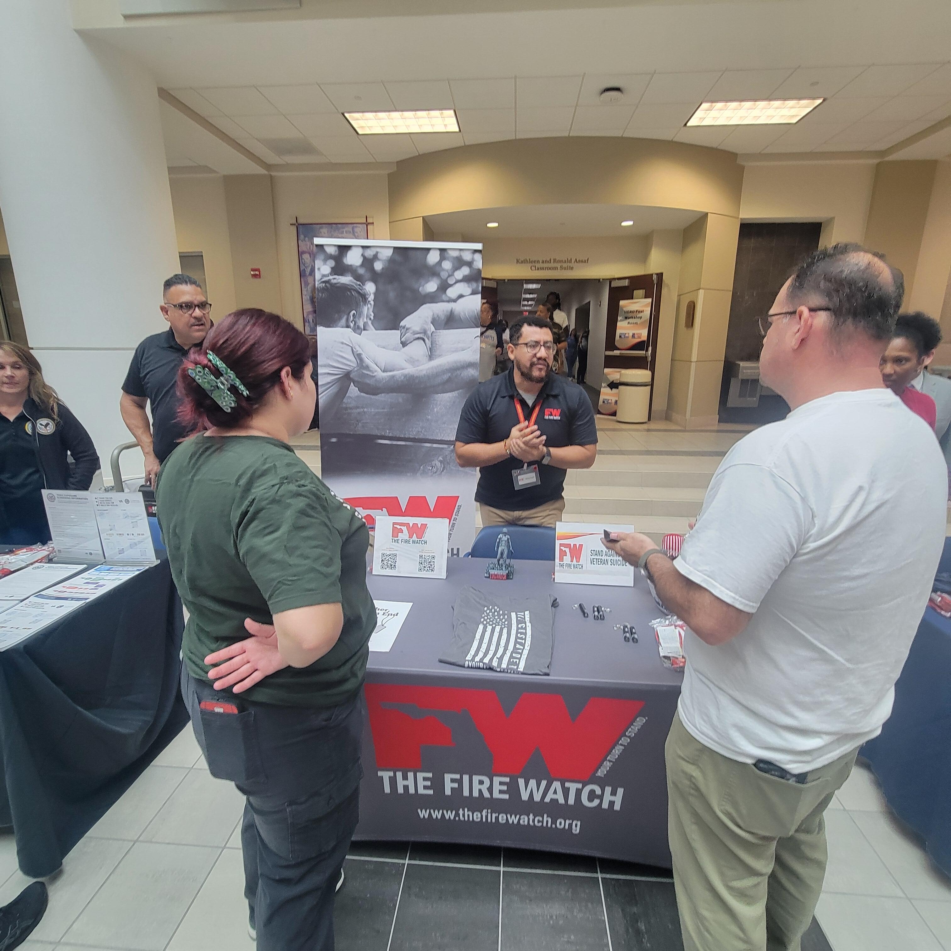 Vet Info's Mark and Samantha Checking out The Fire Watch Table.