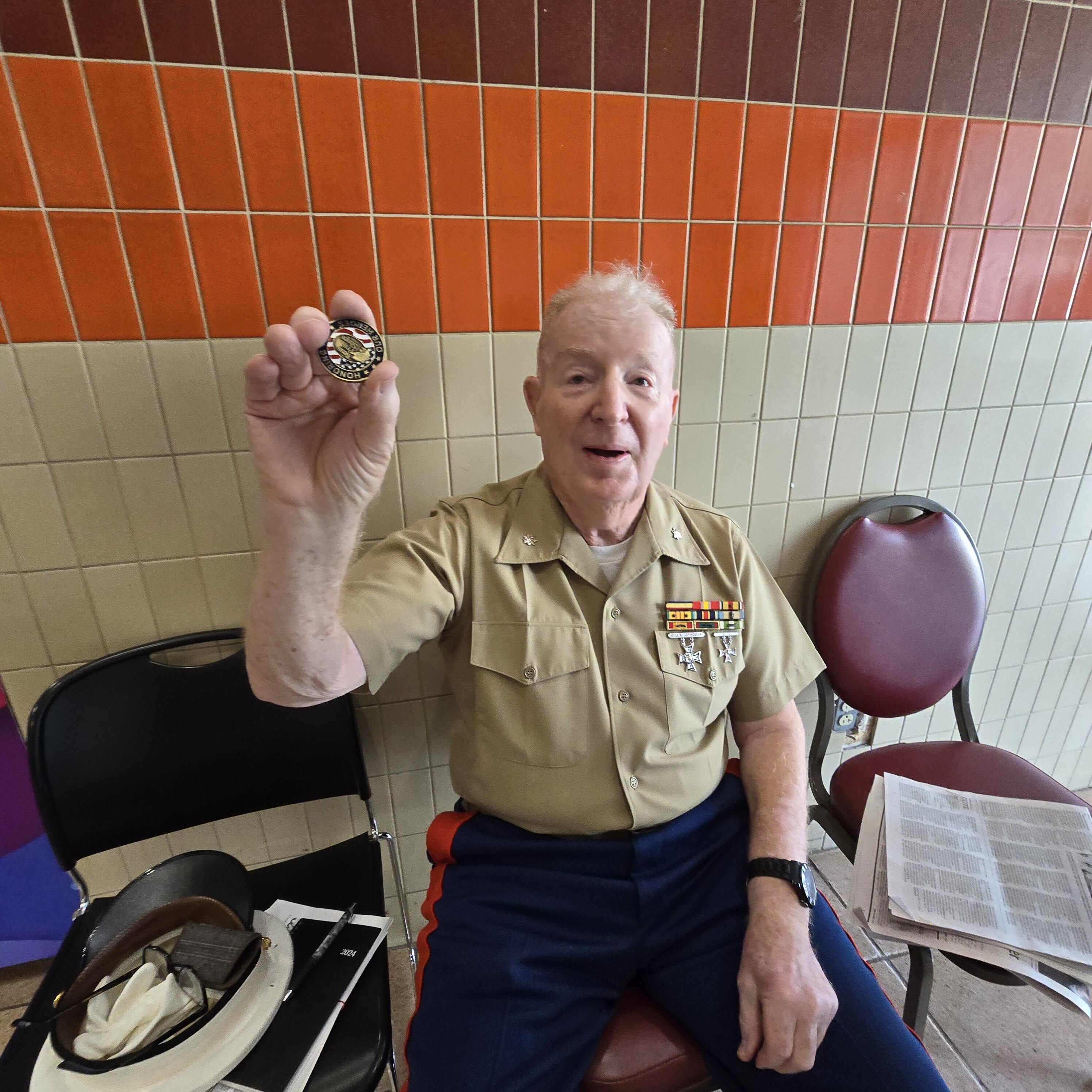 Lt. Col. showing off his Bass Pro Challenge Coin.